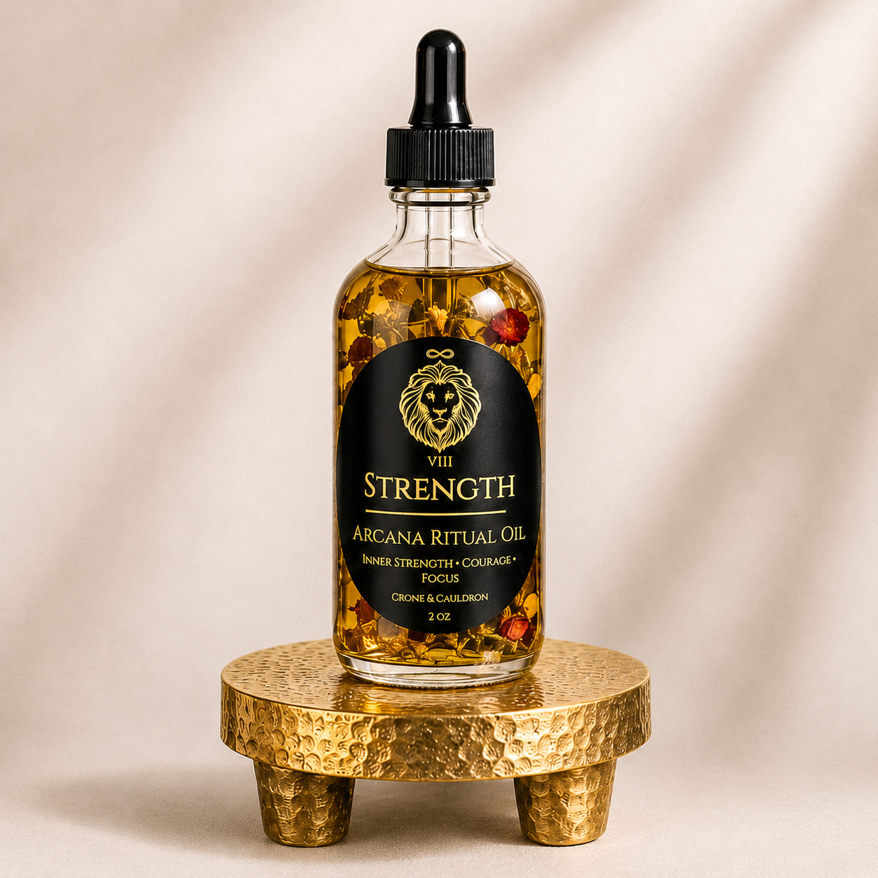A 2 oz glass bottle of Arcana Rituae Oil by VII Strength, filled with golden oil and suspended botanicals, displayed on a textured gold stand against a warm beige background.